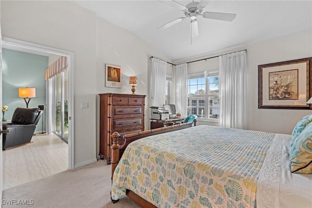 carpeted bedroom with vaulted ceiling and ceiling fan