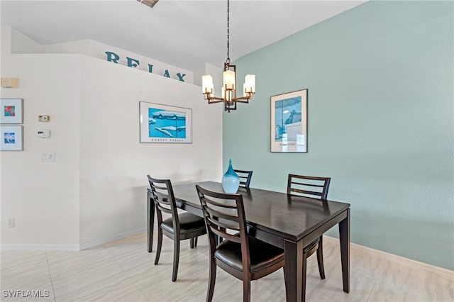 dining area featuring a notable chandelier