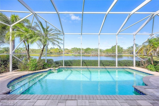 view of swimming pool with a water view and a lanai