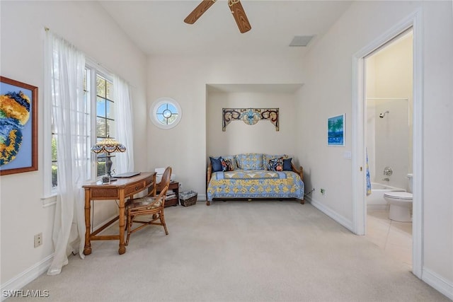 living area with carpet floors, visible vents, baseboards, and a ceiling fan