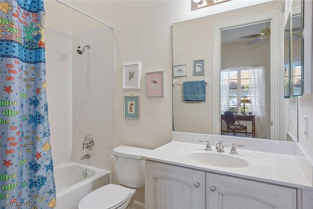 bathroom with ceiling fan, vanity, shower / bath combination with curtain, and toilet