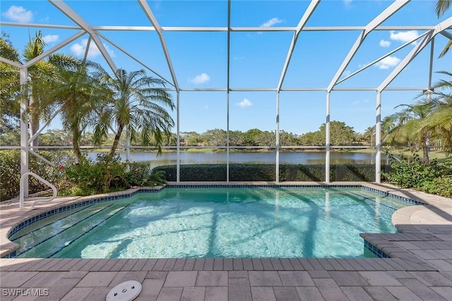 pool with a water view, a lanai, and a patio