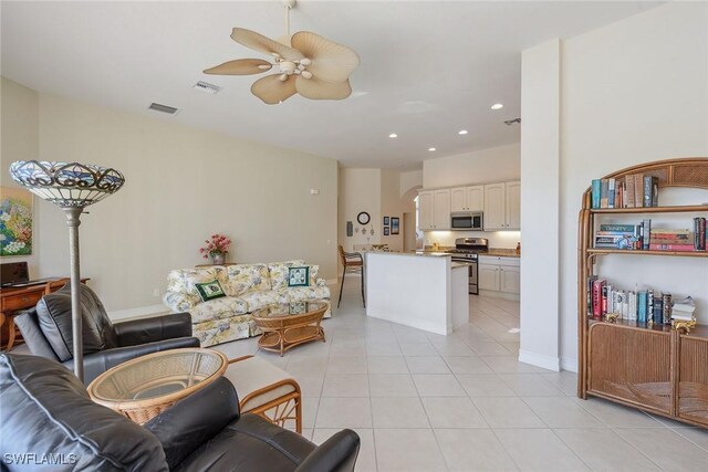 living room with recessed lighting, ceiling fan, visible vents, and light tile patterned floors