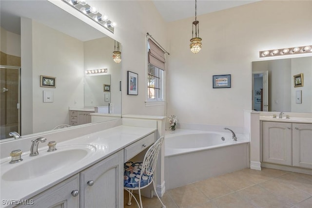 full bathroom featuring two vanities, tile patterned floors, a shower stall, and a sink