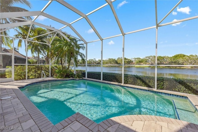 pool featuring a patio, a water view, and a lanai