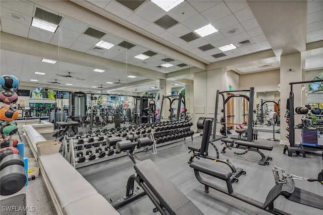workout area featuring a drop ceiling and visible vents