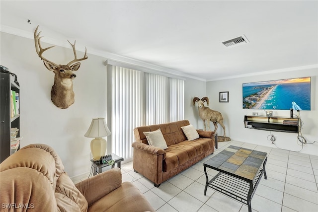 living room featuring light tile patterned floors, visible vents, and crown molding