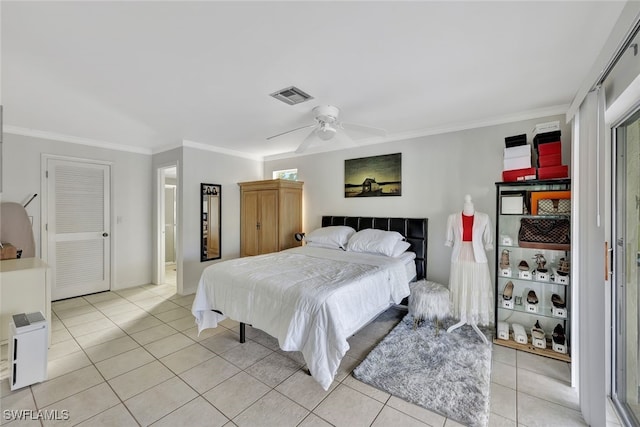 bedroom with light tile patterned floors, visible vents, and crown molding