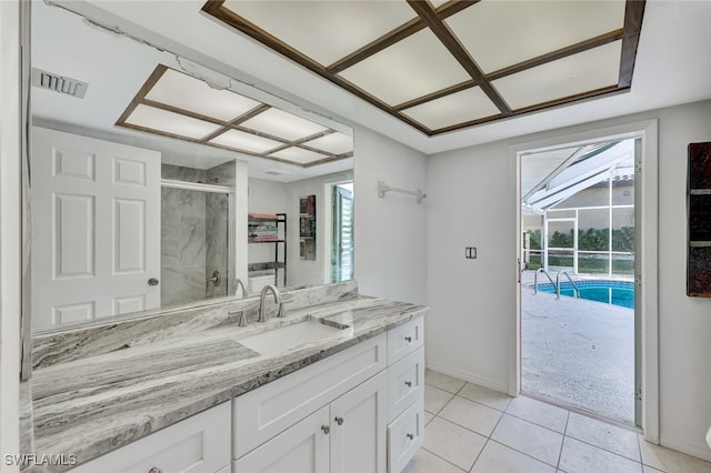 full bathroom with visible vents, a stall shower, vanity, tile patterned flooring, and baseboards