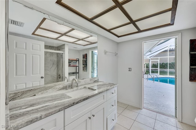 119 SW 54th St, Cape Coral, FL 33914 - bathroom with a shower stall, tile patterned floors, vanity, and baseboards