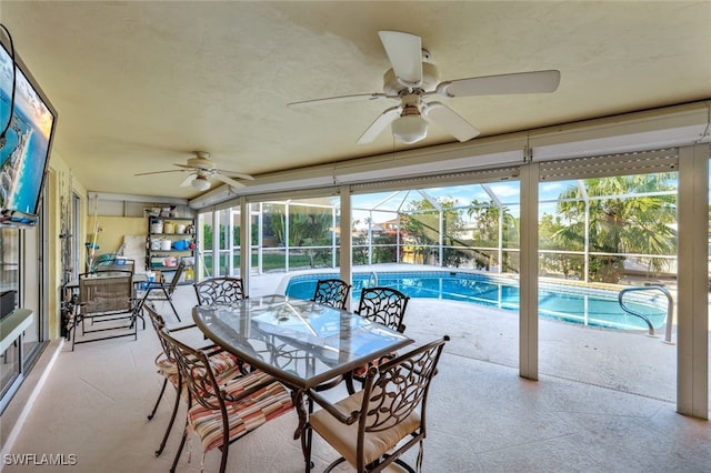 sunroom featuring plenty of natural light and ceiling fan