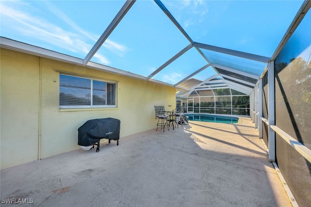 view of patio / terrace with a lanai, a grill, and an outdoor pool