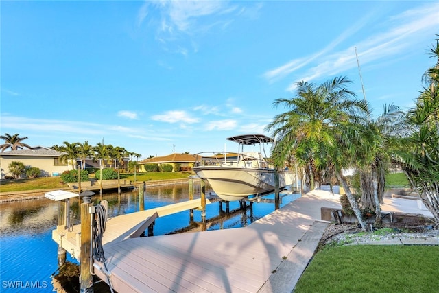 dock area with a water view and boat lift