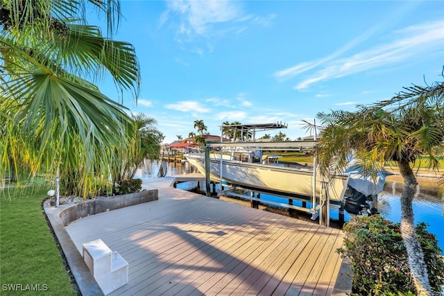 view of dock with a water view and boat lift