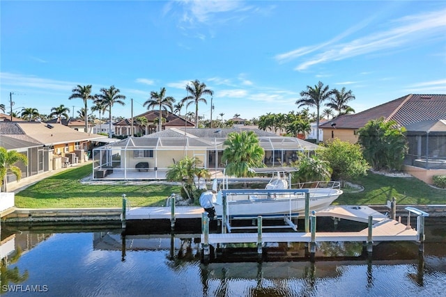 view of dock with a yard, boat lift, a water view, glass enclosure, and a residential view