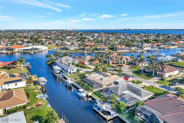 bird's eye view with a residential view and a water view