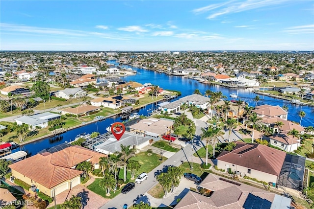 aerial view featuring a residential view and a water view