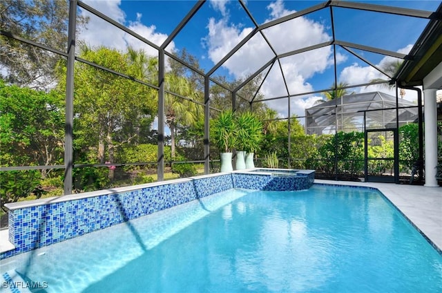 view of swimming pool with a lanai, a patio, and an in ground hot tub