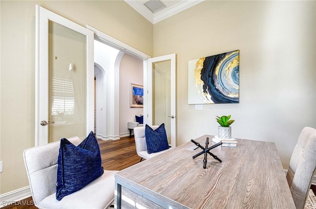 office area featuring wood-type flooring and ornamental molding