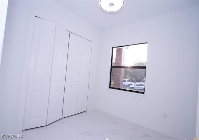 unfurnished bedroom with a closet