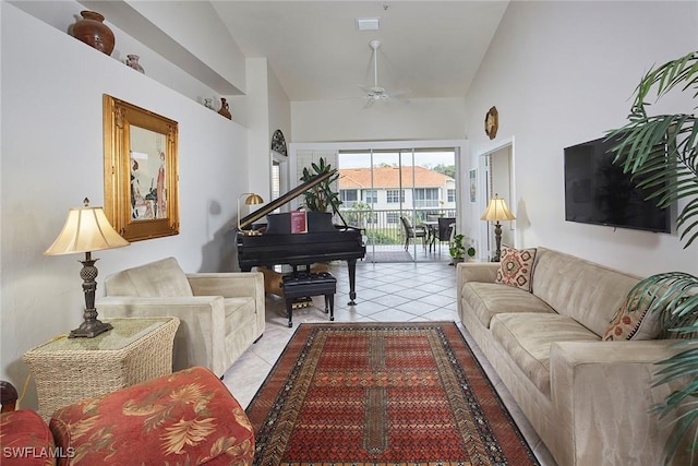 living room with light tile patterned floors, high vaulted ceiling, and ceiling fan