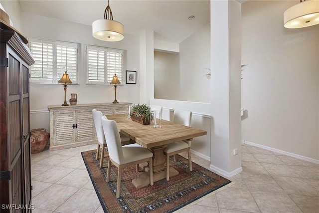 dining area with light tile patterned floors