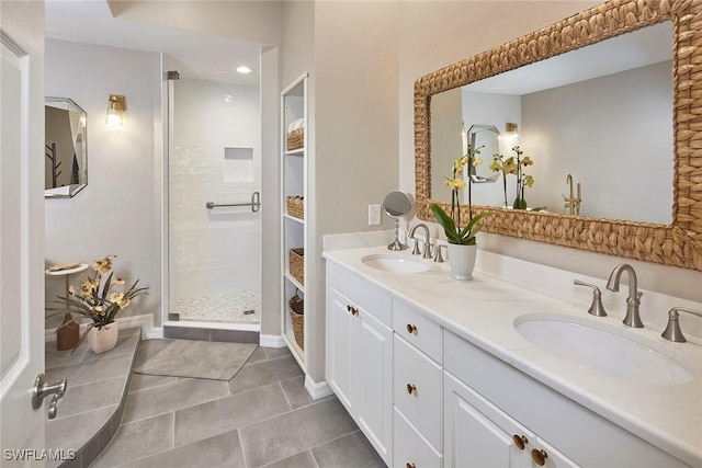 bathroom featuring vanity, tile patterned flooring, and walk in shower