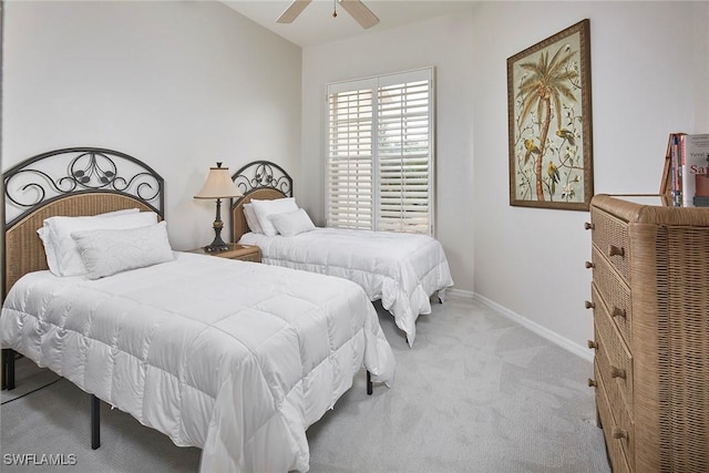 bedroom with ceiling fan and light carpet