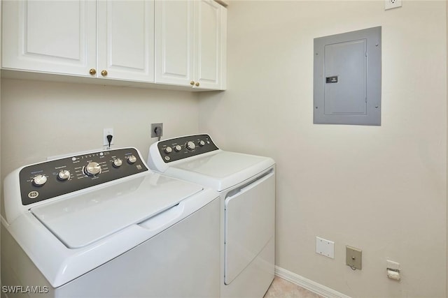 clothes washing area with cabinets, electric panel, and washing machine and dryer