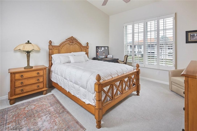 1033 Egrets Walk Cir Unit 203, Naples, FL 34108 - bedroom featuring light colored carpet, baseboards, and ceiling fan