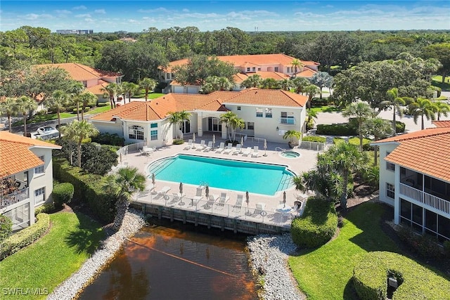 1033 Egrets Walk Cir Unit 203, Naples, FL 34108 - community pool featuring a patio area, a water view, and a residential view
