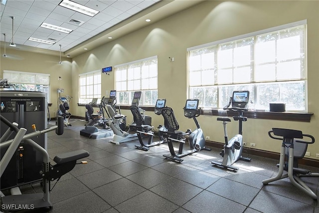 1033 Egrets Walk Cir Unit 203, Naples, FL 34108 - exercise room with a drop ceiling and baseboards