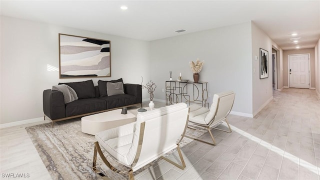 living room with light hardwood / wood-style floors