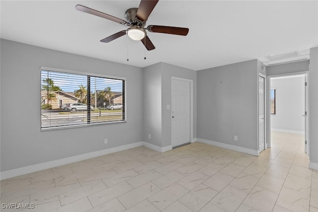 spare room with ceiling fan