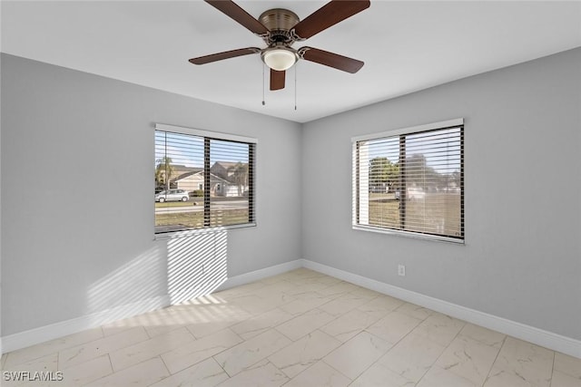 empty room with plenty of natural light and ceiling fan