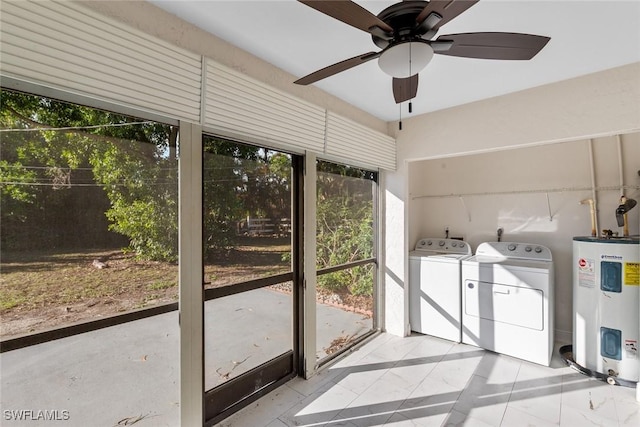 unfurnished sunroom with separate washer and dryer, electric water heater, and ceiling fan