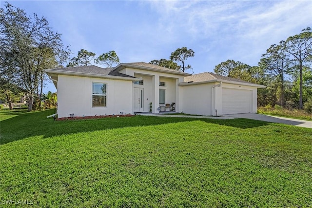 prairie-style home featuring a garage, a front lawn, concrete driveway, and stucco siding