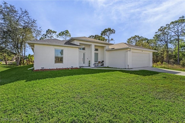 3607 38th St SW, Lehigh Acres, FL 33976 - prairie-style house with stucco siding, a front lawn, a garage, and driveway