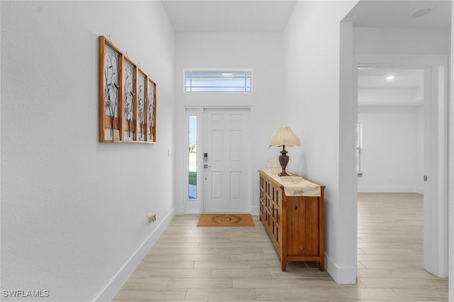 foyer with light hardwood / wood-style floors