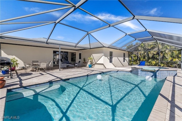 view of pool with an in ground hot tub, a lanai, and a patio