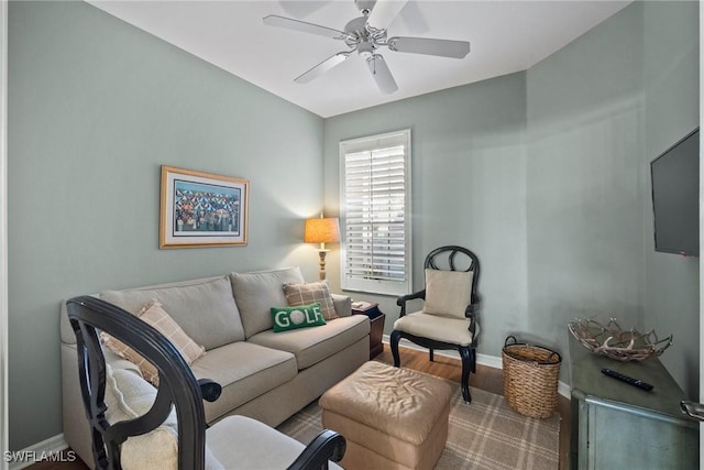 living room with ceiling fan and hardwood / wood-style floors