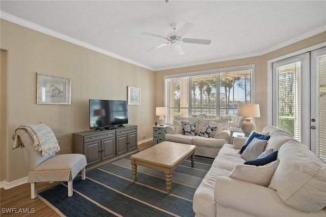 living room with crown molding, ceiling fan, and dark hardwood / wood-style flooring