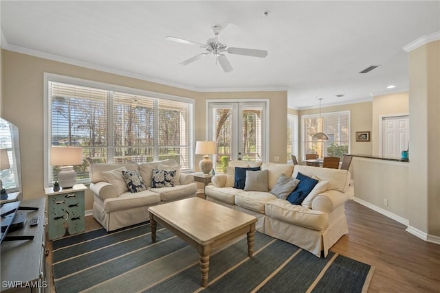 living room with french doors, ceiling fan, ornamental molding, and dark hardwood / wood-style floors