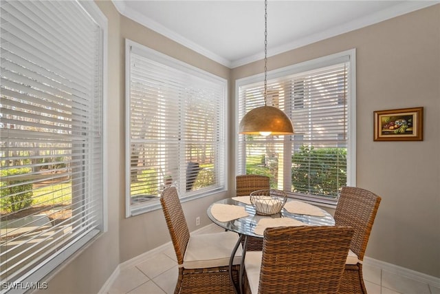 dining room featuring light tile patterned floors and crown molding