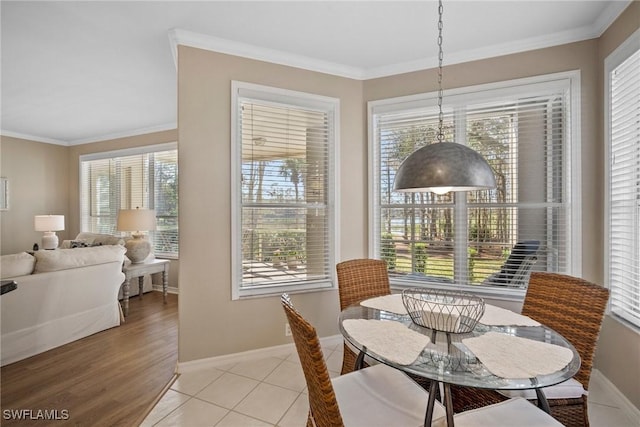 tiled dining room with crown molding