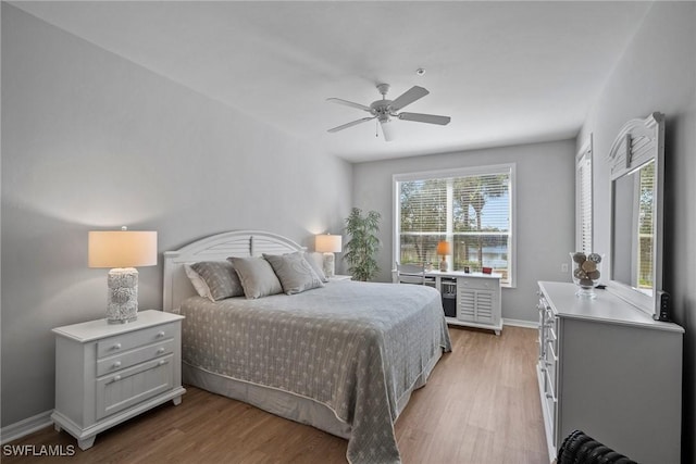 bedroom featuring ceiling fan and light wood-type flooring