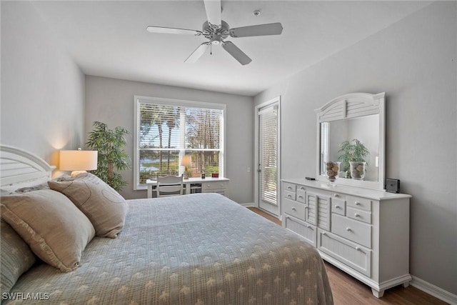 bedroom with dark wood-type flooring, ceiling fan, and a closet