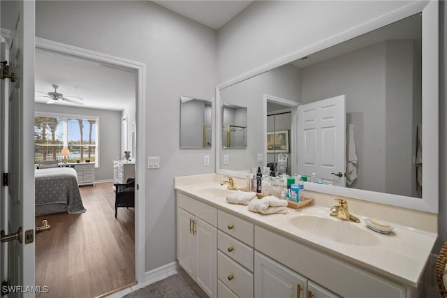 bathroom with vanity, hardwood / wood-style floors, and ceiling fan