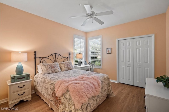 bedroom featuring light hardwood / wood-style flooring, a closet, and ceiling fan