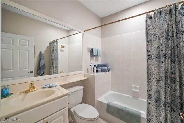 full bathroom with vanity, toilet, and shower / bath combo with shower curtain